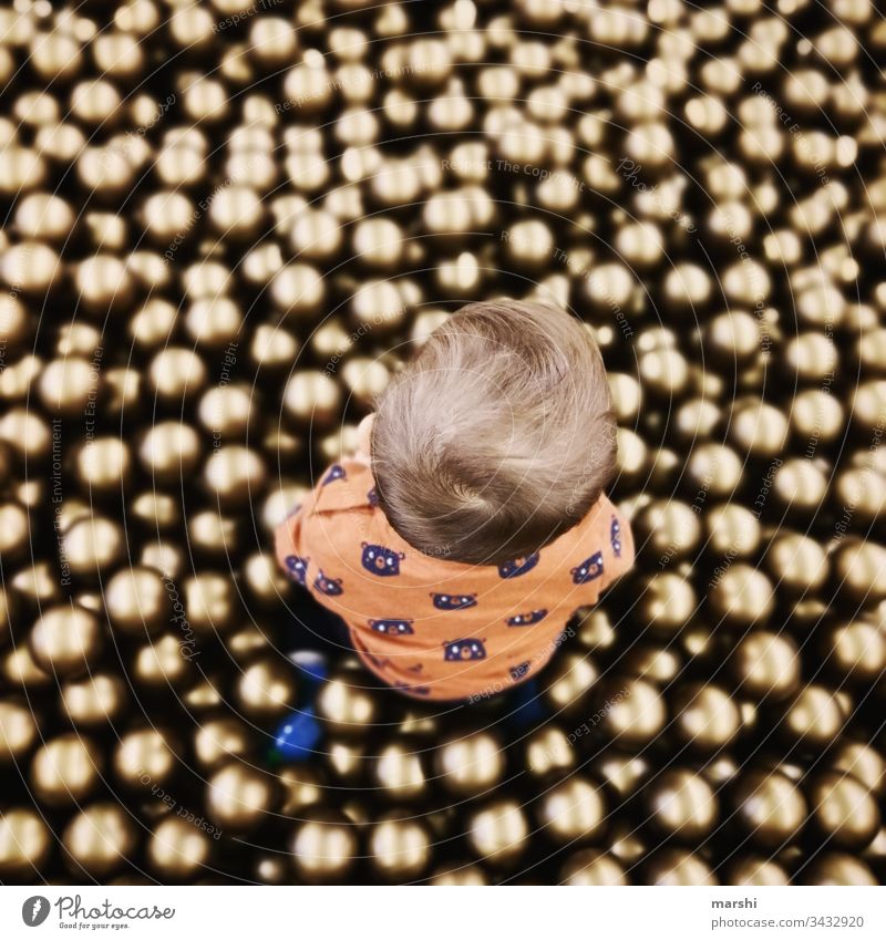 Ball paradise Child Boy (child) Playing game balls ball pool cute Infancy from on high Round Joy human free time Playground fortunate Colour photo Son Mother