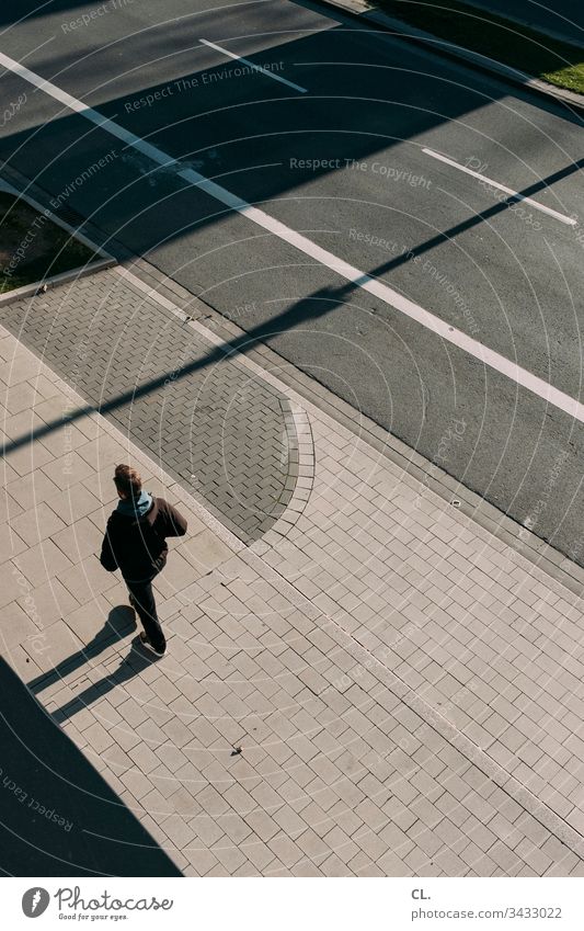 a man walks on the sidewalk Man person Going stroll off Street Pedestrian Adults Human being Exterior shot Colour photo 1 Day Loneliness Lanes & trails