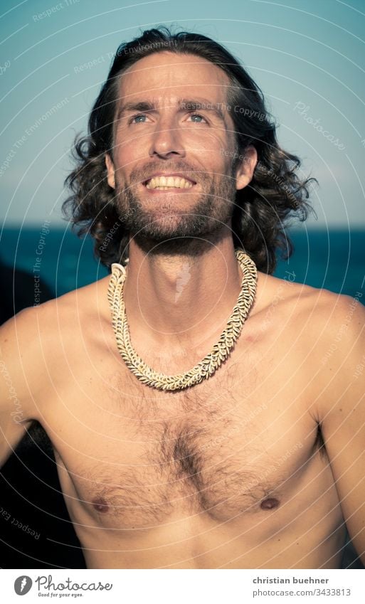 portrait - young man by the sea Man Young man long hairs relaxed Sunset Ocean Beach Waves Sunbeam vacation nice Facial hair Surfer Laughter kind blue eyes