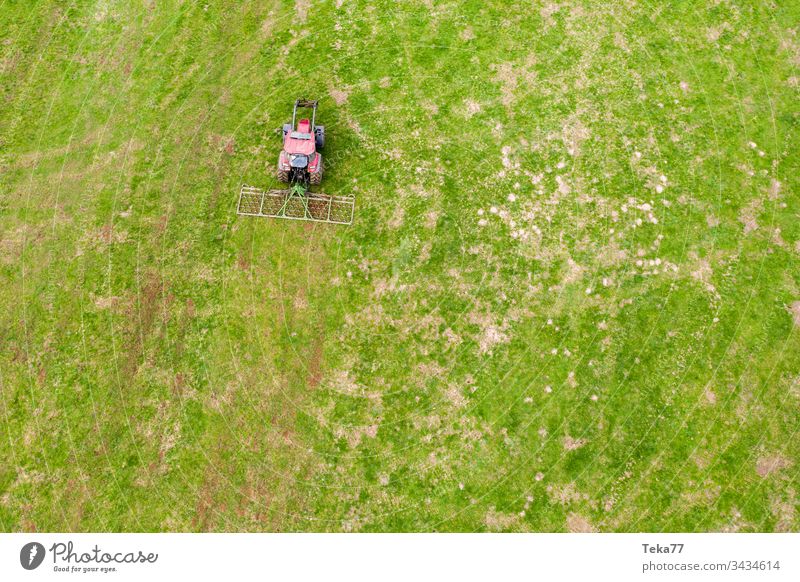 tractor on a meadow from above #2 farming tractor agriculture agricultural field grass modern modern agriculture modern machine farming machine farming truck