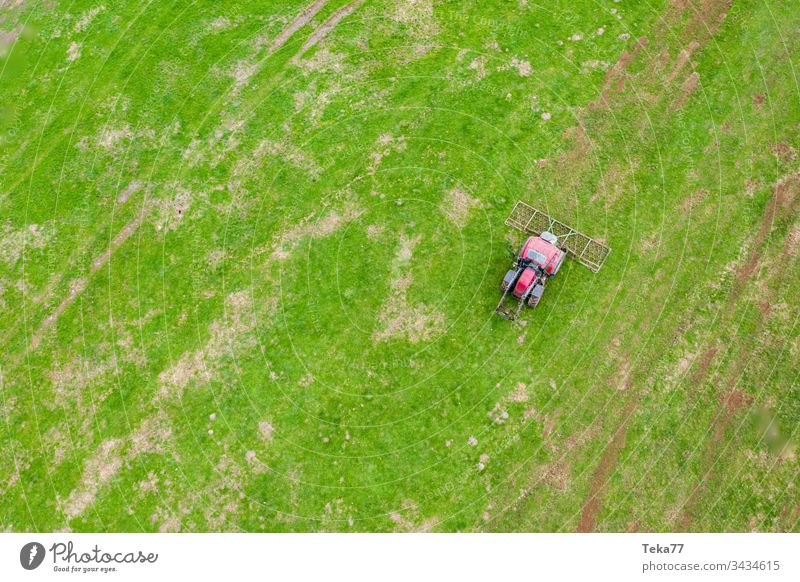 tractor on a meadow from above #1 farming tractor agriculture agricultural field grass modern modern agriculture modern machine farming machine farming truck