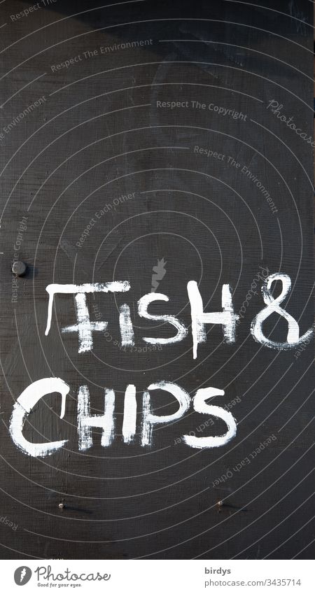Fish and chips, writing on the board at a restaurant or snack bar, gastronomy fish and chips Eating to go English Fast food traditionally Tradition