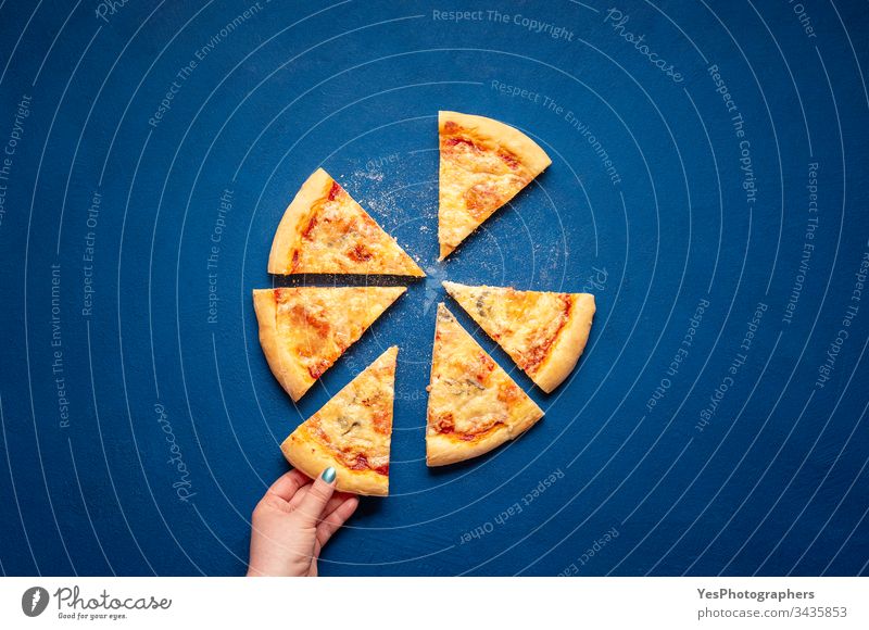Sliced four cheese pizza. Taking a pizza slice 4 cheese pizza Italian above view carbohydrates carbs classic blue crust cuisine dinner eating european famous