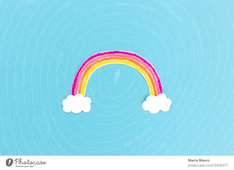 Colourful rainbow painted from paper with white clouds on light blue background Rainbow Child Creativity Painting (action, artwork) Handicraft Image Painted