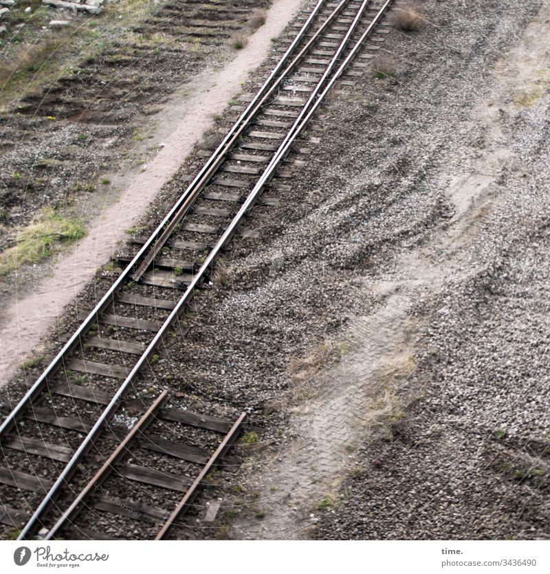 more gravel than coal Railroad tracks Rail transport Traffic infrastructure Earth Gravel Bird's-eye view Track bed truncated Puzzle vegetation Construction site