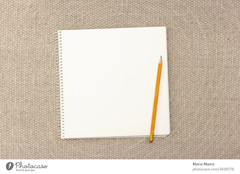 Premium Vector  Blank page of notebook, sketchbook, album. pencils are  near the notebook