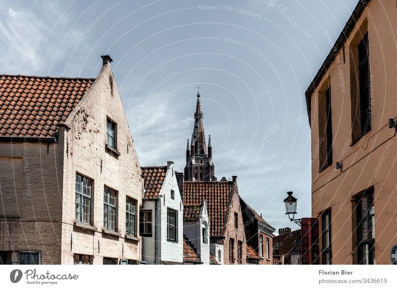 Residential buildings in the old town of Bruges with view of the Liebfrauenkirche House (Residential Structure) Window Facade Building style Window pane