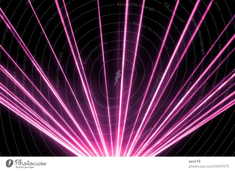 Pink laser show nightlife club stage and shining sparkling rays. Luxury entertainment in nightclub event, festival, concert or New Years Eve. Ray beams are symbol for science and universe research