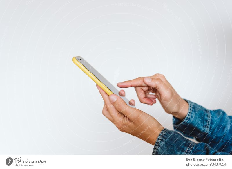 close up view of a woman using mobile phone indoors. Technology concept girls female one person unrecognizable technology wireless working internet texting