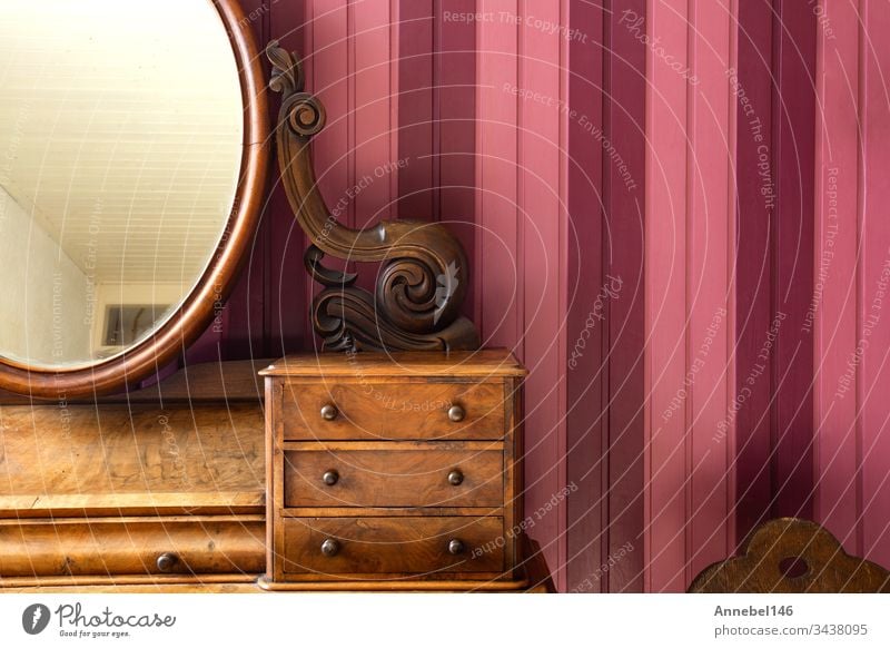 Stylish room interior with chest of drawers and round mirror Stock Photo