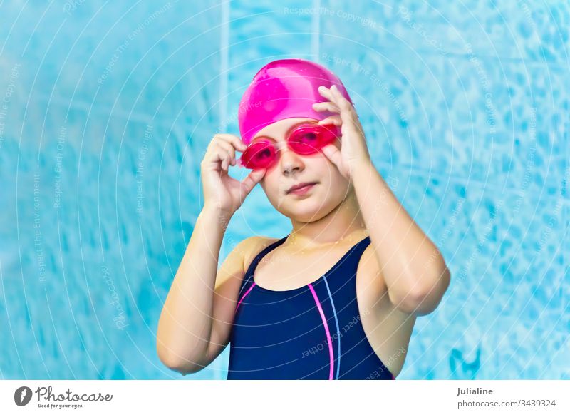 Cute girl in swimming pool child kid preschooler schoolgirl six seven white childhood Caucasian european water wet glare sport