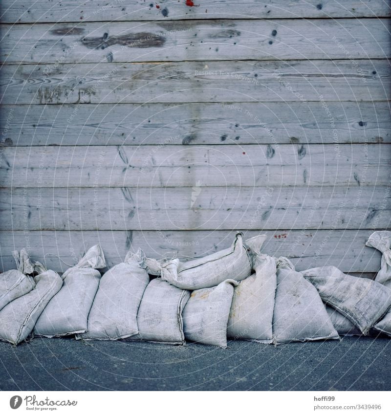 before the flood - sandbags in front of the boarding shed Coast Flood minimalism North Sea Sandbag guard sb./sth. inundation flood protection storm tide