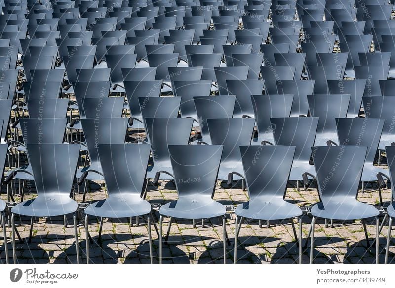 Open air theater empty seats. Rows of empty chairs outdoor abandoned aligned audience background blue city event festival chairs no people nobody open-air