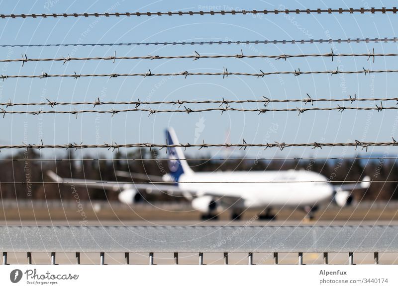 great break Airplane Barbed wire Fence Airport Barbed wire fence Aviation Exterior shot Deserted Airfield Vacation & Travel Tourism Flying Passenger plane