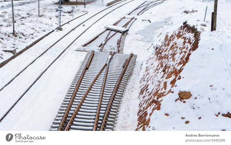 Snowy train tracks railway vanishing modern seasonal forward transport natural northern snowy direction freeze railroad frost transportation transit forest