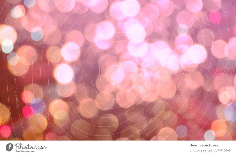 A blurry pink background with circles of light. Bokeh pink