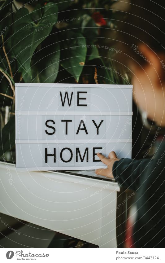 Child looks at message Stay at home stay at home Quarantine Quarantine period stay safe Home Lifestyle Lettering Copy Space Family & Relations Safety