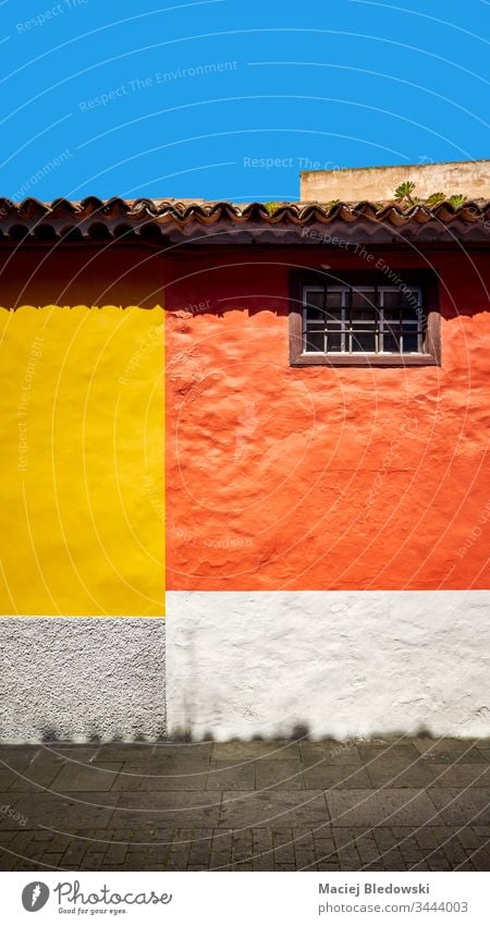 Colorful wall of a house. colorful building orange yellow background La Laguna city street Tenerife Spain architecture San Cristobal de La Laguna old town