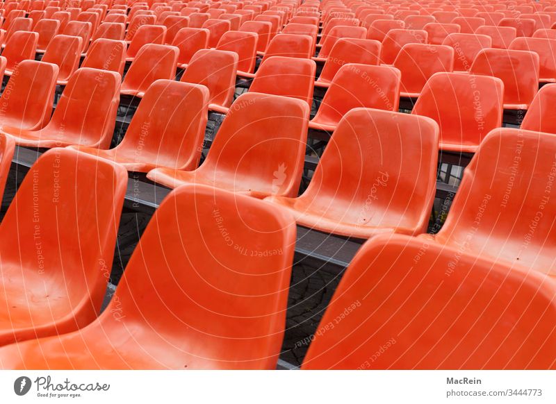 Red rows of seats Row of seats series chairs Empty unmanned vacant places Event nobody Copy Space Visitor