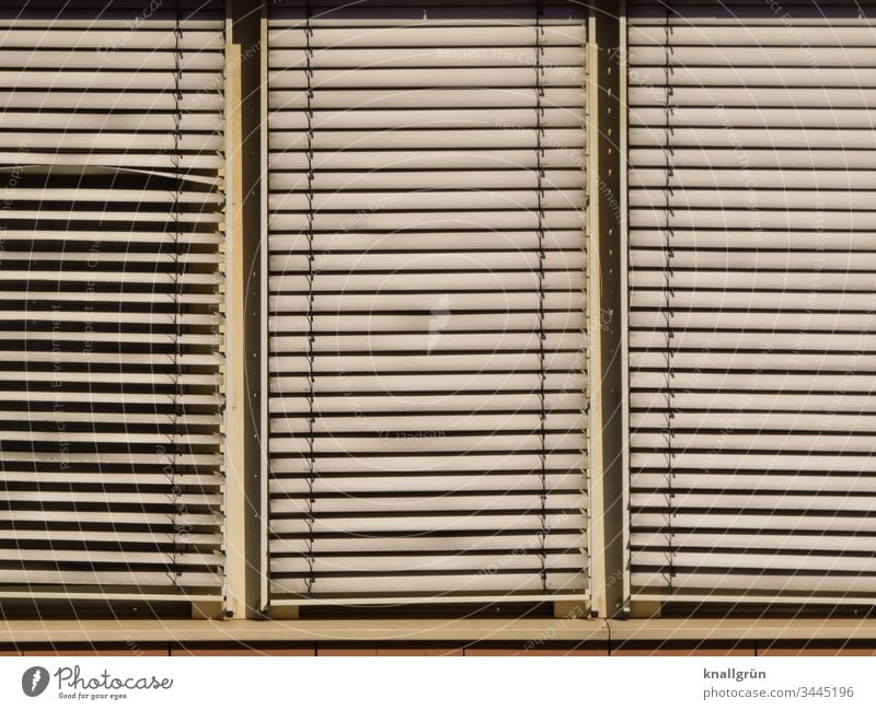 Three-part window with dirty aluminium blind Venetian blinds Window Protection Line Exterior shot Closed frowzy Dirty Structures and shapes Slat blinds slanting
