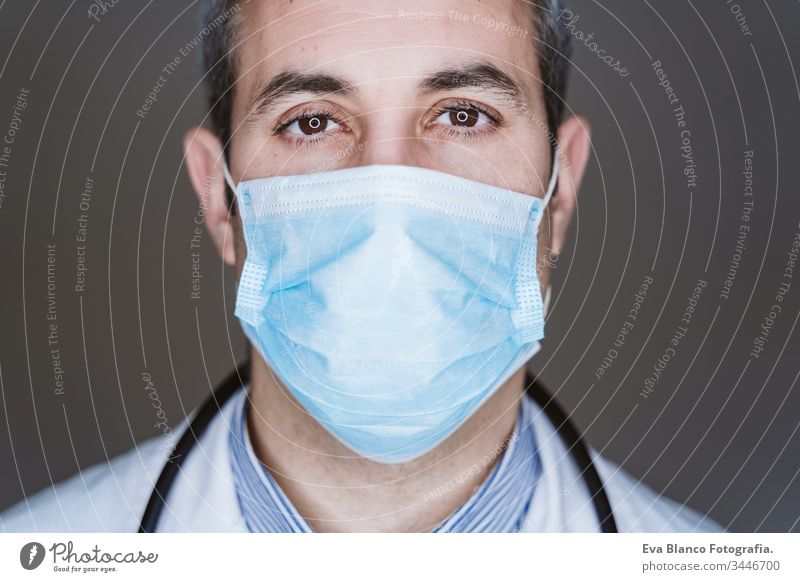 close up view of doctor man wearing protective mask and stethoscope. Coronavirus Covid-19 concept portrait professional corona virus hospital working infection