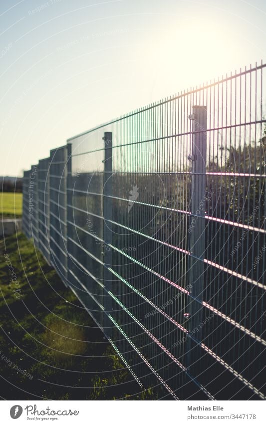Galvanized metal fence Metal Fence Exterior shot Orderliness Protection Steel Network Deserted Structures and shapes Close-up Colour photo Get stuck Biased