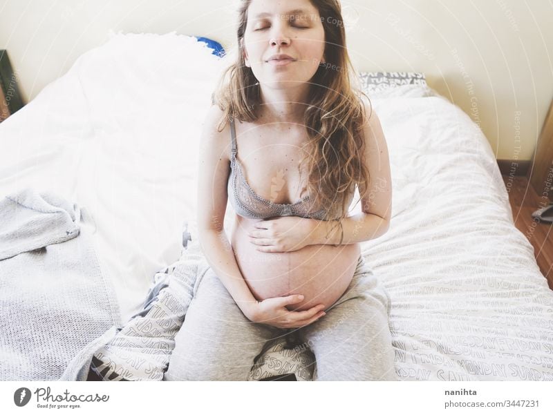 Young pregnant woman alone in home in quarantine pregnancy mother mom isolated at home family love health care lonely tired insomnia pretty beauty beautyful