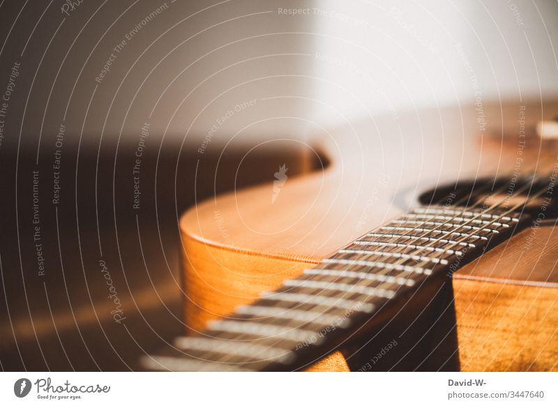 Guitar musical instrument lies on the floor and is illuminated by sunlight Lie Music Musical instrument Sunlight Ground Break time-out Copy Space top Shadow