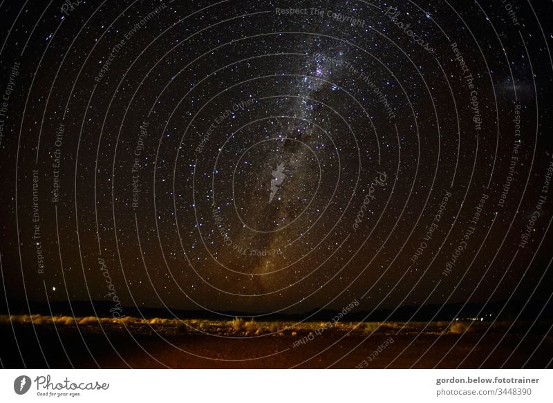 Starry sky over Namibia Night shot Colour Panorama picture Long exposure Black Deserted Dark little flora Exterior shot Night sky Mountains in the background