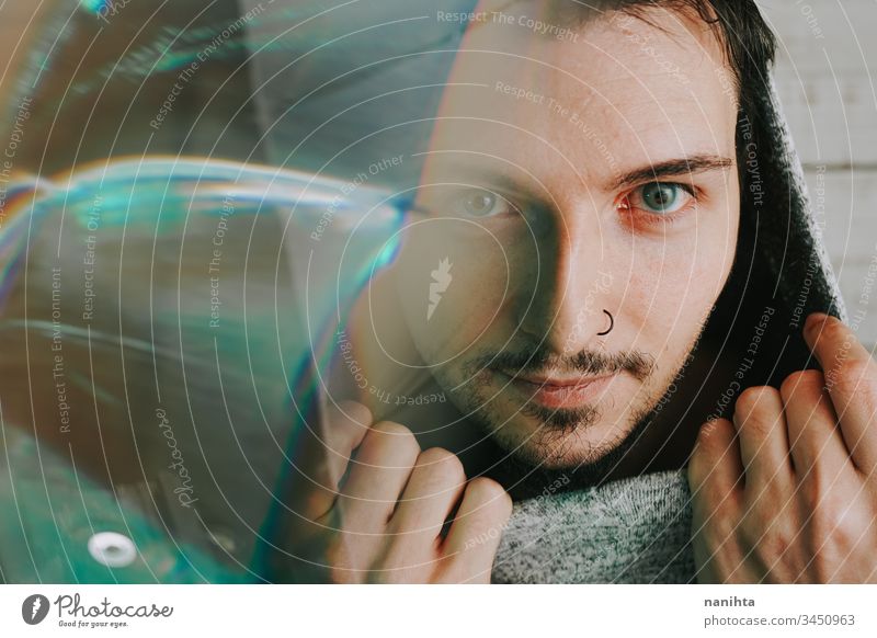 Artistic and futuristic portrait of an attractive young man guy face prism effect modern casual light art abstract artistic portraiture cool beard bearded