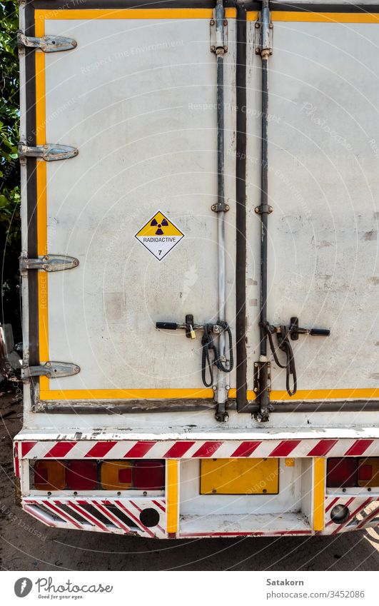 Radiation warning sign on the Dangerous goods transport label Class 7 at the container of transport truck radioactive transportation symbol aluminium hazardous