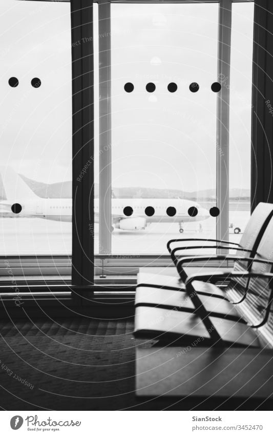 Empty airport terminal waiting area with chairs in Athens airport travel b/w black white flight airplane luggage departure transportation trip baggage