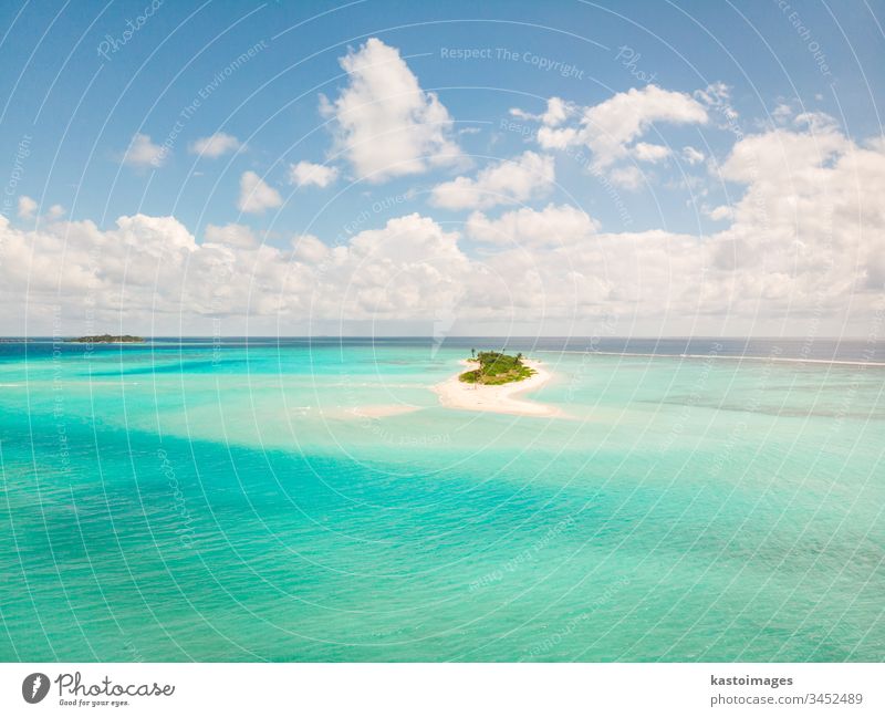 Picture perfect beach and turquoise lagoon on small tropical island on Maldives ocean sea coast sand landscape nature scenery tourism vacation water sky