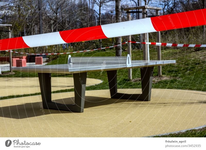 closed-off playground cordoned off Playground Table tennis table corona Restriction Empty forbid flutterband Day coronavirus Protection Risk of infection