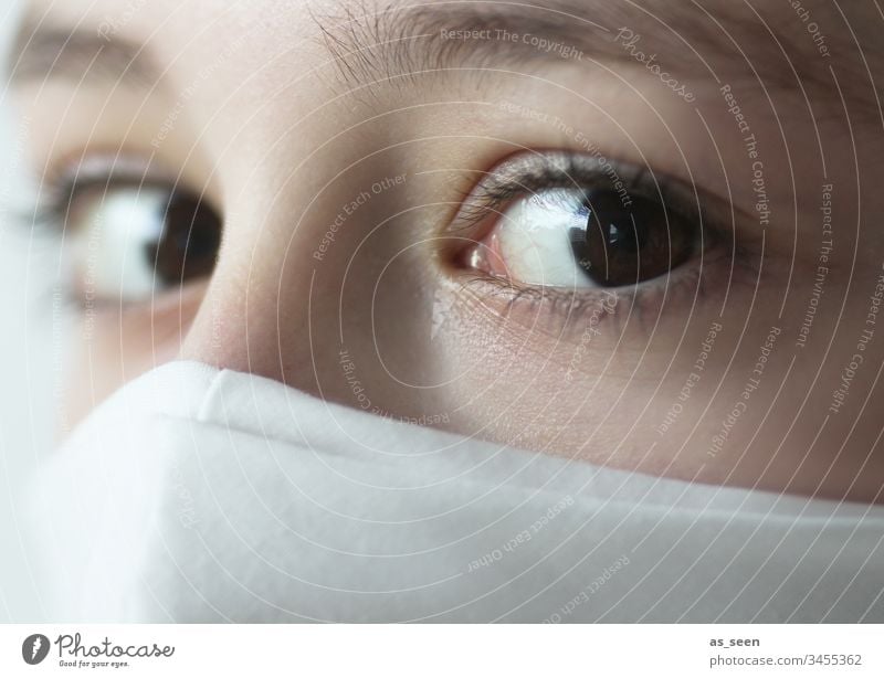 Fearful look of a girl wearing a mask Looking eyes Respirator mask White Protection threat Mask Human being Portrait photograph Threat Colour photo 1 Breathe