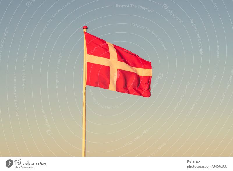 Danish flag at dawn waving in the wind danish flag independent friendship material identity destination travel international copenhagen patriot glory white red