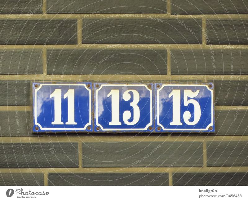Three blue enamelled house numbers with white numbers 11, 13 and 15 screwed tightly together House number house number plate Digits and numbers Enamel sign