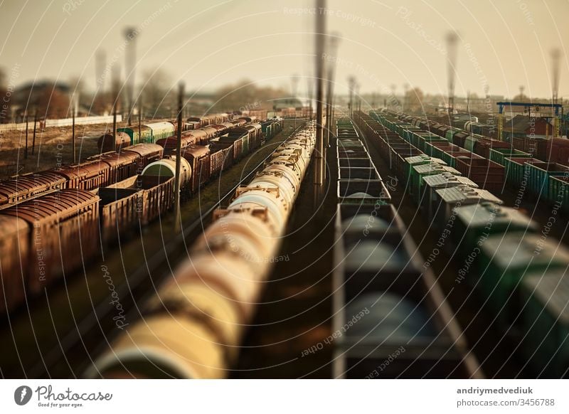 Freight railway cars at the railway station. Top view of cargo trains.Wagons with goods on railroad. Heavy industry. Industrial conceptual scene with trains. selective focus