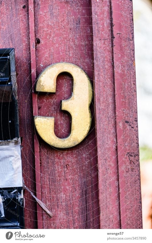 Number 3 on a wooden gate Digits and numbers Close-up Exterior shot House number Orientation Goal front door Colour photo