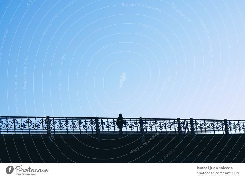 tourist walking on the bridge in Bilbao city Spain, man silhouette person people human pedestrian shadow street outdoors abstract minimal action tourism