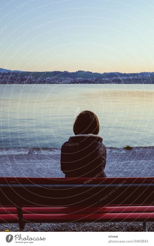 Boy on a bench by the lake Boy (child) Bench Twilight evening mood Calm Peaceful Spring Lake zurich insulation on one's own Lonely Exterior shot Sky Loneliness