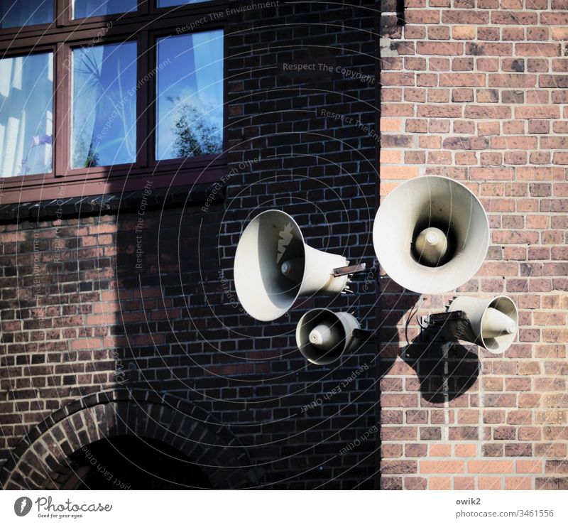 Listen up, everybody. Loudspeaker Signal station Wall (barrier) House (Residential Structure) house corner Wall (building) Facade Brick wall Brick facade