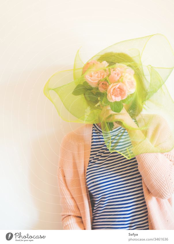 Faceless female portrait with flowers covering her face faceless womens day bouquet mothers day shy woman bunch pink rose holding young beautiful beauty floral