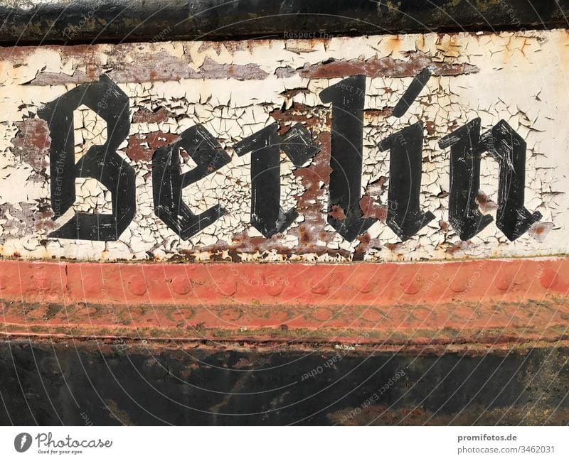 Flaking Berlin lettering on metal / Photo: Alexander Hauk Capital city Germany Typography Federal capital Metal Black White Red ship boat Rust age Yellowed