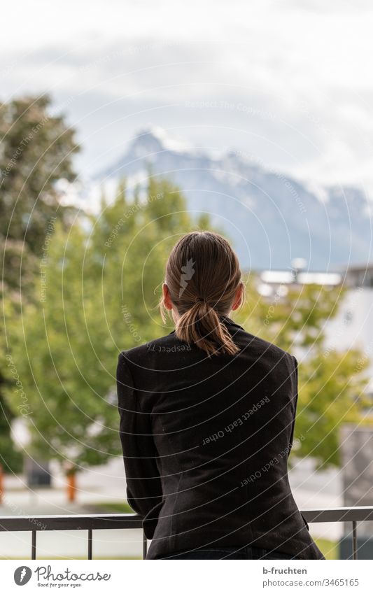 Woman on terrace with view to the mountains Handrail Balcony Business Sky Relaxation Landscape recover jacket Suit University & College student hair Forward