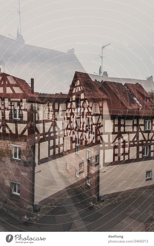 Double exposure of a street with half-timbered houses Escape from reality Really Dream Vacation & Travel Tourism Inverted Castle in the air Sustainability