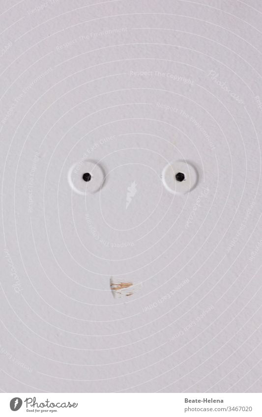 White wall with two drill holes and scratch: a mute observer with big eyes Wall (building) Face saucer-eyed Scrape Mouth astonished look Restraint attention