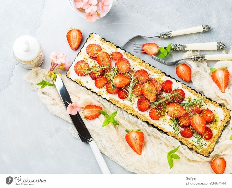 Home made strawberry not baked cheese cake ricotta background gray cream delicious fruit mint food sweet fresh home made pastry pie enamel tin summer dessert