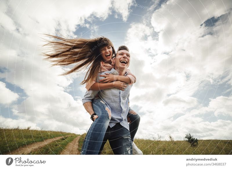 Young couple with beautiful bodies in swimwear having fun on a tropical  beach - a Royalty Free Stock Photo from Photocase