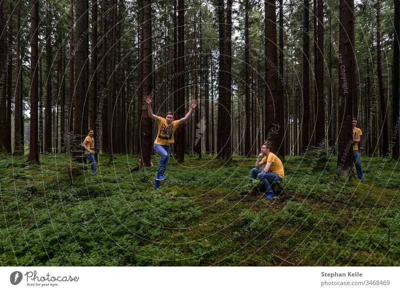 Fun in a forest, multiple selfie in different poses. Selfie tree nature Photoshop green fun hide jump person man Men same Colour photo Exterior shot landscape